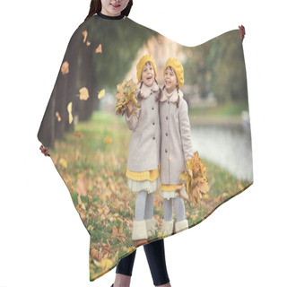 Personality  Sisters Twins In Coats And Yellow Berets Have Fun Walking In The Autumn City Park With Yellow Leaves. Hair Cutting Cape