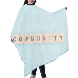 Personality  Top View Of Community Lettering Made Of Wooden Cubes On Blue Background  Hair Cutting Cape