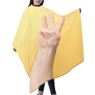 Personality  Cropped View Of Man Showing Three Fingers On Yellow Background  Hair Cutting Cape