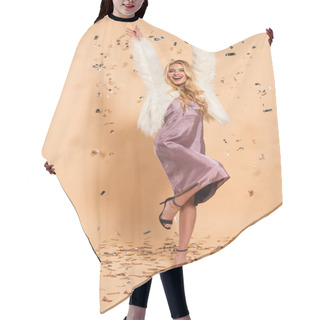 Personality  Happy Blonde Woman In Violet Satin Dress And Faux Fur Coat Dancing Under Silver Falling Confetti On Beige Background Hair Cutting Cape