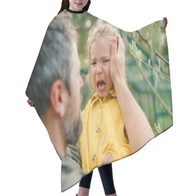 Personality  A Father Holding His Crying Little Daughter And Comforting Her In Garden Hair Cutting Cape