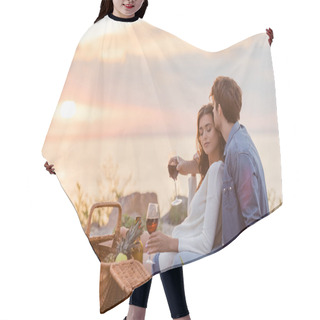 Personality  Selective Focus Of Couple Holding Glasses Of Wine During Picnic On Beach At Evening  Hair Cutting Cape