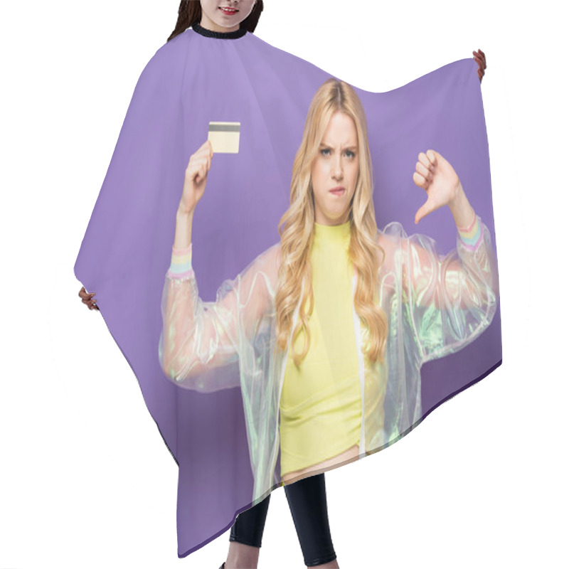 Personality  Sad Blonde Young Woman In Colorful Outfit Showing Credit Card And Thumb Down On Purple Background Hair Cutting Cape