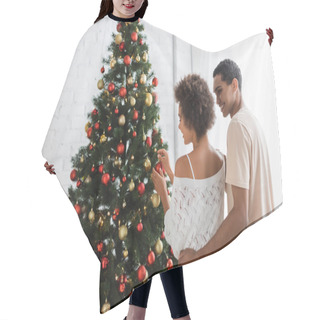 Personality  Smiling African American Man Hugging Sexy Woman Decorating Spruce With Christmas Baubles Hair Cutting Cape