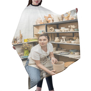 Personality  Brunette Female Artisan In Apron Looking Away And Making Clay Vase On Pottery Wheel In Workshop Hair Cutting Cape