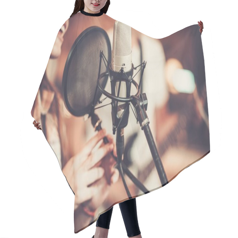 Personality  Woman singer in a recording studio  hair cutting cape