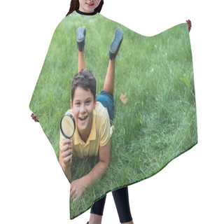 Personality  Cheerful Boy Lying On Grass And Holding Magnifier  Hair Cutting Cape