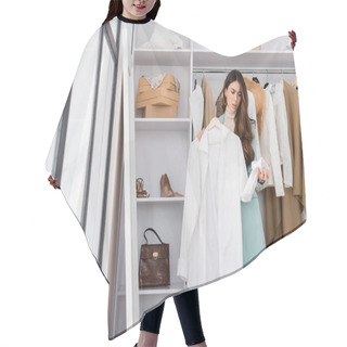 Personality  Confused Woman Holding Hanger With Shirt In Wardrobe  Hair Cutting Cape