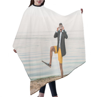 Personality  Surprised Man In Black Jacket, Shorts And Flippers Touching Swimming Mask On Beach Near Sea Hair Cutting Cape