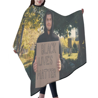 Personality  Happy Young Man In Hoodie Holding Placard With Black Lives Matter Lettering Outside  Hair Cutting Cape
