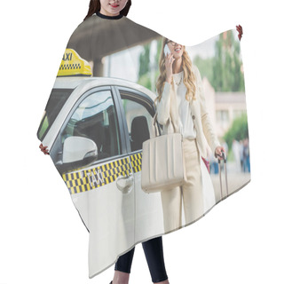 Personality  Smiling Blonde Woman In Eyeglasses Talking By Smartphone While Standing With Suitcase Near Taxi Cab  Hair Cutting Cape