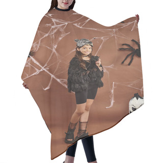 Personality  Cheerful Preteen Girl Standing Still In Black Faux Fur Attire With Brown Backdrop, Halloween Hair Cutting Cape
