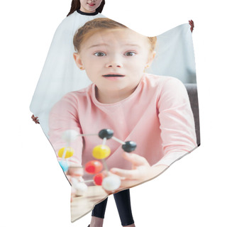 Personality  Shocked Child Holding Molecular Model And Looking At Camera Hair Cutting Cape