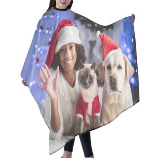 Personality  Happy African American Girl With Waving Hand Lying On Floor Near Cat And Labrador In Santa Hat On Blurred Background Hair Cutting Cape