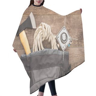 Personality  Top View Of Backpack With Axe, Hiking Rope And Gas Burner On Wooden Table Hair Cutting Cape