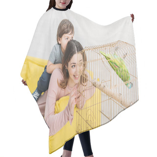 Personality  Smiling Mother And Son Looking At Green Parrot In Bird Cage At Home Hair Cutting Cape