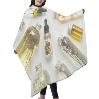 Personality  Top View Of Transparent Bottles With Natural Beauty Products And Dried Wildflowers On Grey Background  Hair Cutting Cape