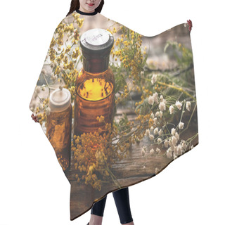 Personality  Wild Flower Essential Oil Bottle On A Wooden Board Background. Herbal Medicine. Hair Cutting Cape