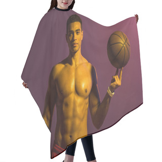 Personality  Good-looking Sportive Mixed Race Man Holding Brown Ball And Looking At Camera On Purple Background Hair Cutting Cape