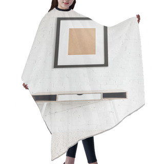 Personality  Modern Table Standing On Carpet Near Black Frame Hanging On White Brick Wall  Hair Cutting Cape