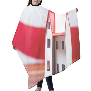 Personality  House Model Near Red Stripped Flag On Blurred Background, Banner Hair Cutting Cape