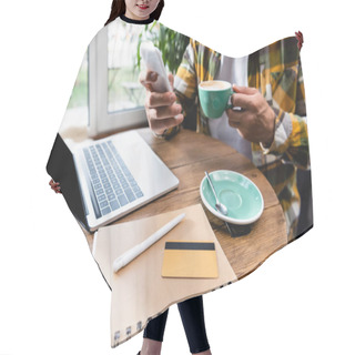 Personality  Cropped View Of Freelancer Chatting On Smartphone And Holding Cup Of Coffee Near Laptop, Notebook And Credit Card In Cafe, Blurred Background Hair Cutting Cape