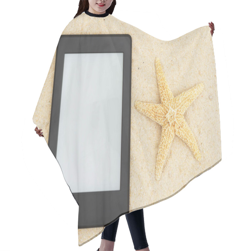 Personality  A blank e-reader on the beach for your summer reading that you can use as a mock up for your message hair cutting cape