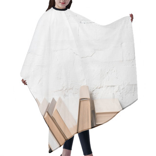Personality  Books With Hardcovers Near White Brick Wall, Educational Background Hair Cutting Cape