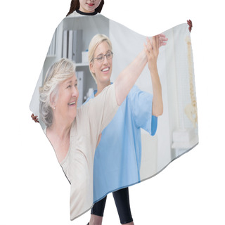 Personality  Nurse Helping Senior Patient In Exercising Hair Cutting Cape