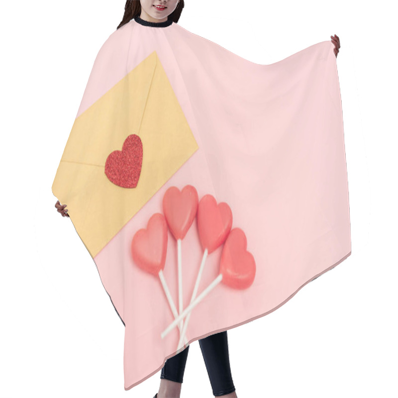 Personality  top view of heart shaped lollipops and envelope with heart on pink background hair cutting cape