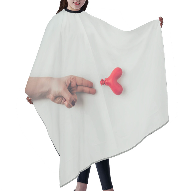 Personality  Cropped Image Of Woman Reaching Out Deflated Balloon With Two Fingers On White, Valentines Day Concept Hair Cutting Cape
