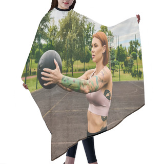 Personality  A Woman In Sportswear, Holding A Ball, Trains Outdoors With Determination And Motivation Hair Cutting Cape