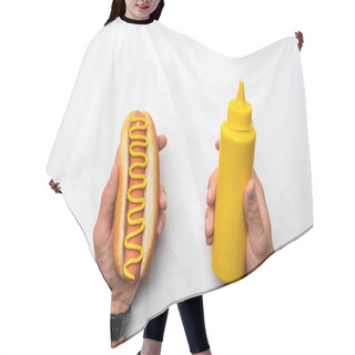 Personality  Cropped Shot Of Man Holding Tasty Hot Dog With Mustard On White Marble Surface Hair Cutting Cape