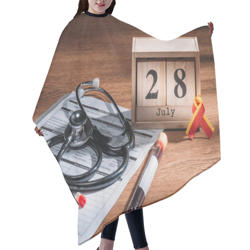 Personality  Selective Focus Of Wooden Calendar With 28th Jule Date, Medical Questionnaire, Pills, Stethoscope, Test Flask With Blood Sample, World Hepatitis Day Concept Hair Cutting Cape