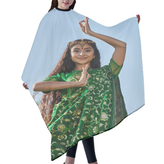 Personality  Portrait Of Stylish Young Indian Woman In Sari And Matha Patti Posing In Park With Blue Sky Hair Cutting Cape