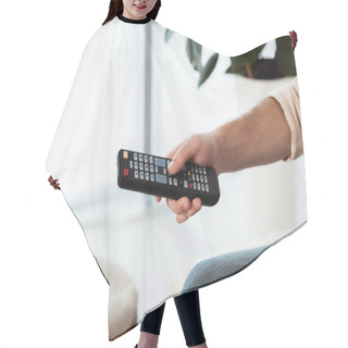 Personality  Cropped View Of Man Holding Remote Controller At Home Hair Cutting Cape