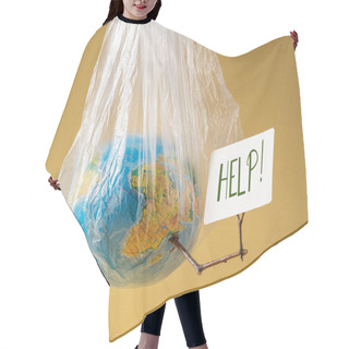 Personality  World Environment Day Concept Earth Holds Card With The Inscription Help Hair Cutting Cape