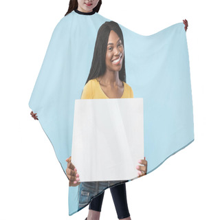 Personality  Positive African American Female Showing Empty Paper Board, Blue Background Hair Cutting Cape