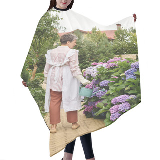 Personality  Appealing Merry Mature Woman In Vivid Dress Watering Her Vibrant Hydrangeas In Her Garden In England Hair Cutting Cape