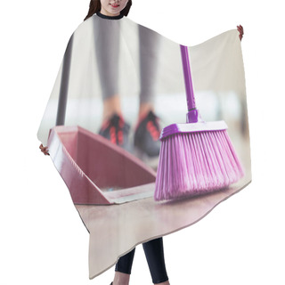 Personality  Close-up Of Young Woman Cleaning Her Flat With Broom And Collector At Home. Hair Cutting Cape