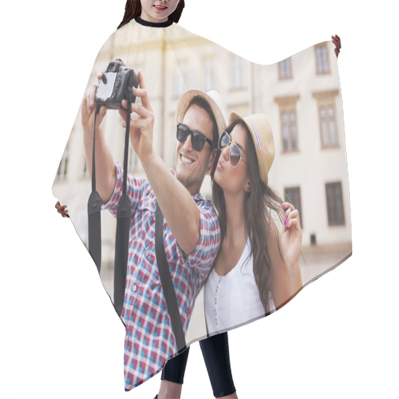 Personality  Happy tourists taking photo of themselves hair cutting cape