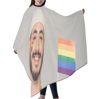 Personality  Cheerful Homosexual Man In Hat Looking At Camera Near Lgbt Flag Isolated On Grey, Banner  Hair Cutting Cape