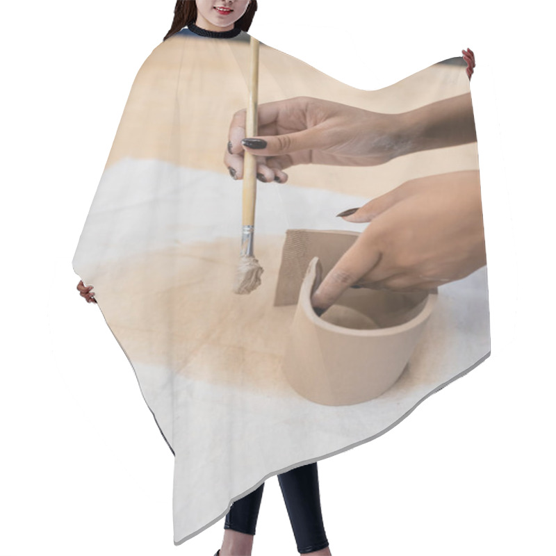 Personality  Cropped View Of African American Woman Holding Shaper While Modeling Clay  Hair Cutting Cape