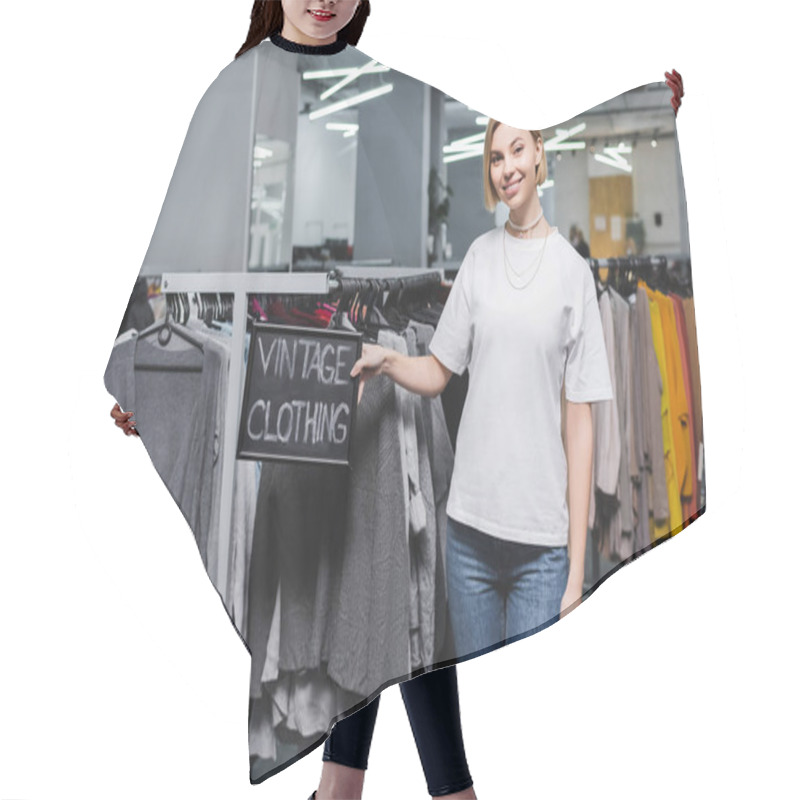 Personality  Smiling Saleswoman Holding Board With Vintage Clothing Lettering In Retro Store  Hair Cutting Cape