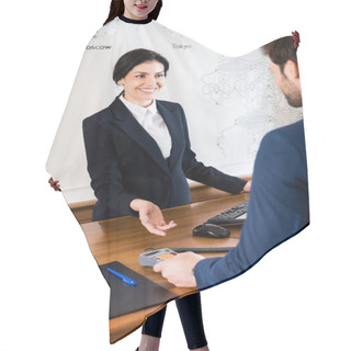 Personality  Cropped View Of Man Paying While Holding Credit Card Near Happy Receptionist In Hotel  Hair Cutting Cape