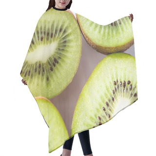 Personality  Top View Of Green And Ripe Kiwifruit Halves On White  Hair Cutting Cape