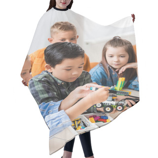 Personality  Selective Focus Of Multiethnic Kids With Building Blocks Modeling Robot In Stem School   Hair Cutting Cape
