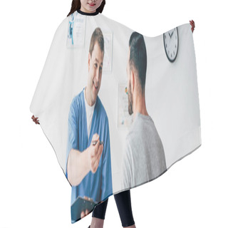 Personality  Panoramic Shot Of Smiling Physiotherapist With Diagnosis Near Patient In Hospital Hair Cutting Cape
