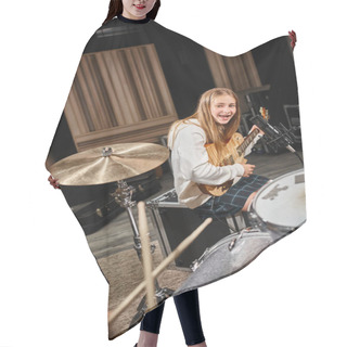 Personality  Jolly Teenage Girl In Casual Outfit Playing Guitar And Looking At Her Friend Playing Drums Hair Cutting Cape