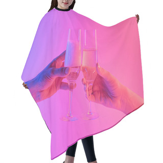 Personality  Partying, Celebration Concept: Two Glasses Of Sparkling Wine In Hands In Bright Neon Background.  Hair Cutting Cape